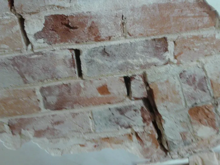 Close-up of HeliBars bonded across a stair-step crack
