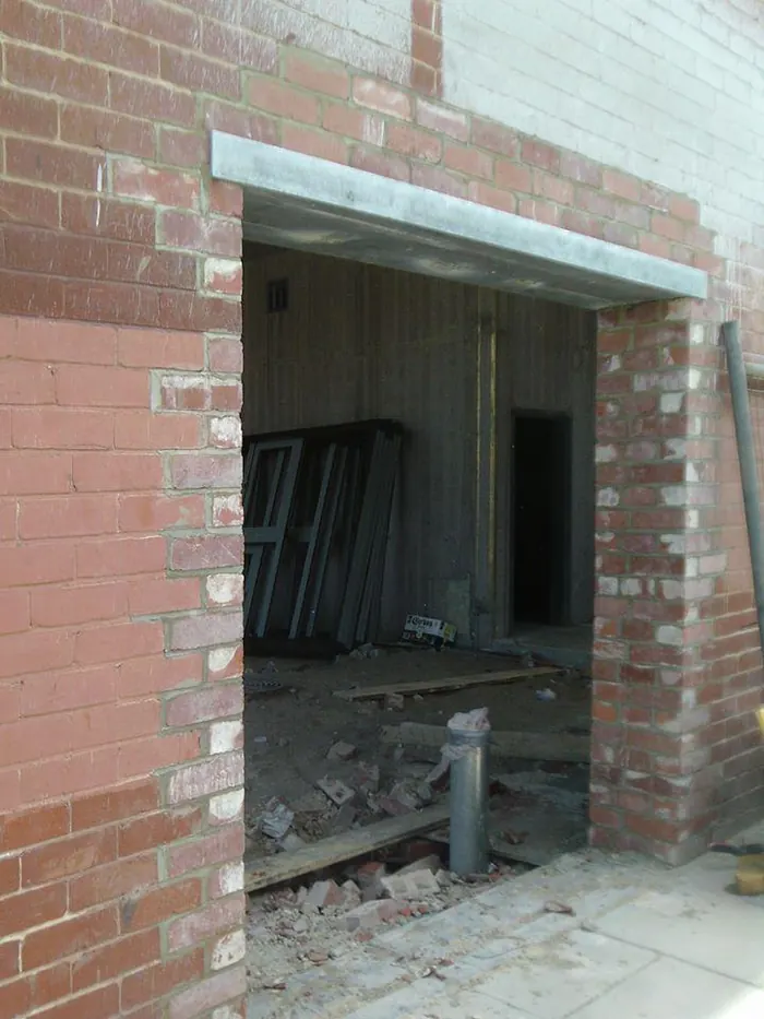 New lintel installed over a door opening