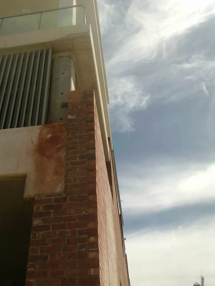Brick pier repair on the facade