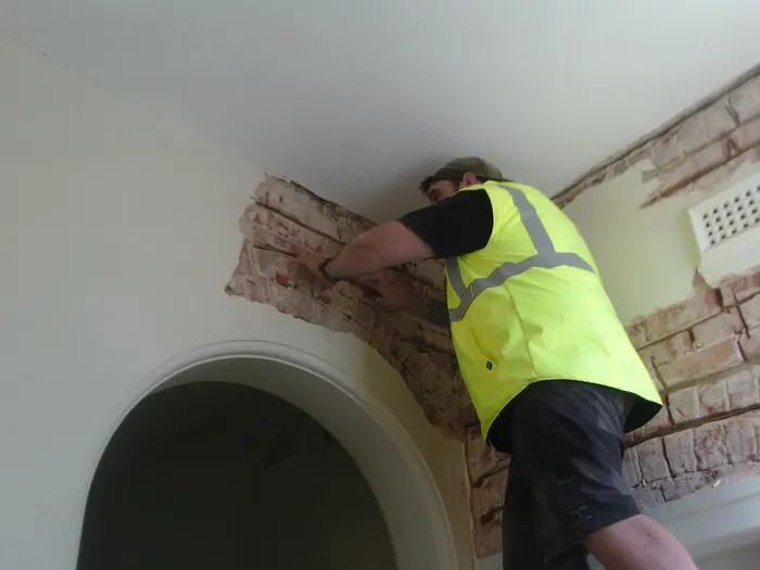 Installing Helifix stitching and beaming inside a house