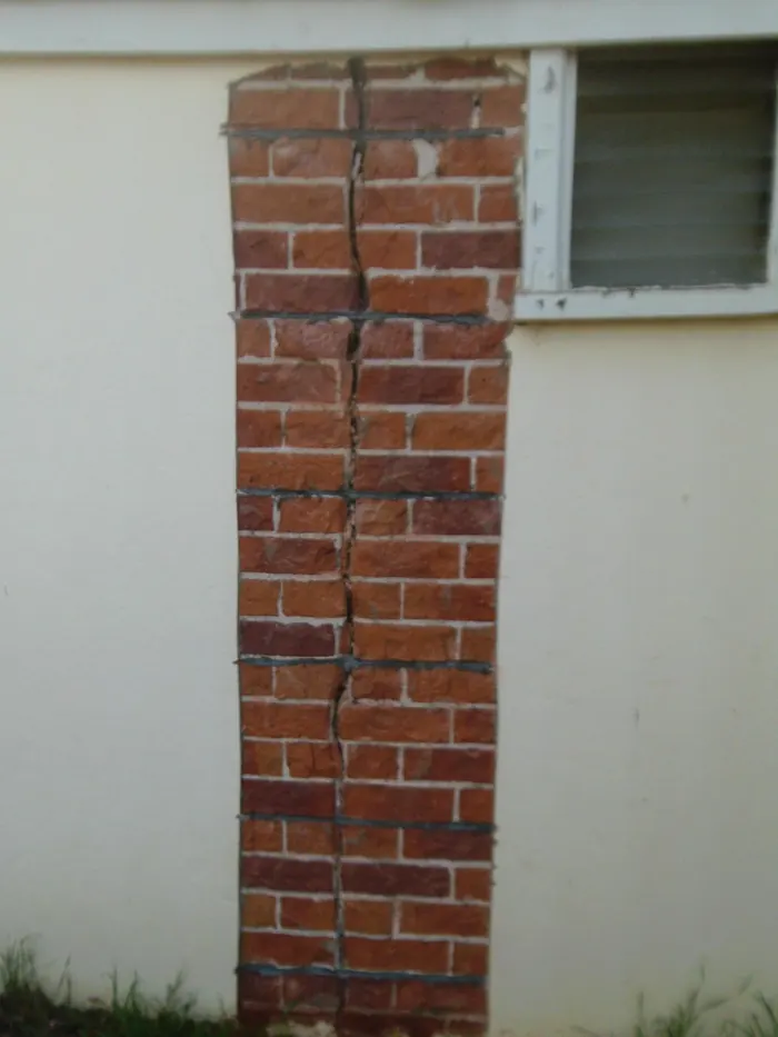 Render removed and Helifix bars installed across the crack