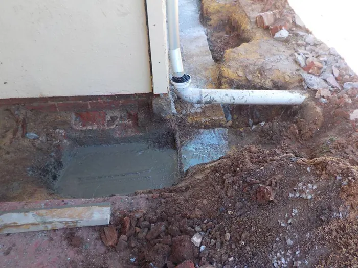 New underpinning poured beneath an existing footing